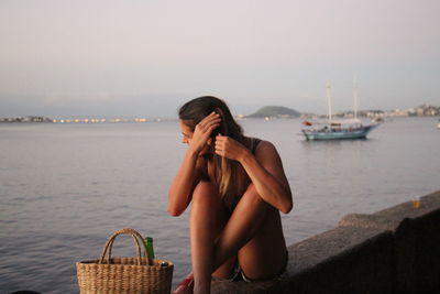 Woman sitting on beach