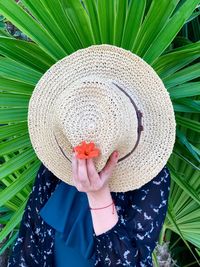 Midsection of woman holding leaves