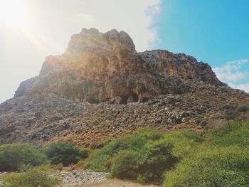 Low angle view of rock formations against sky