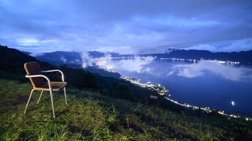 Scenic view of mountains against sky at night