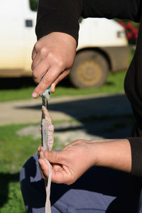 Midsection of person holding hands