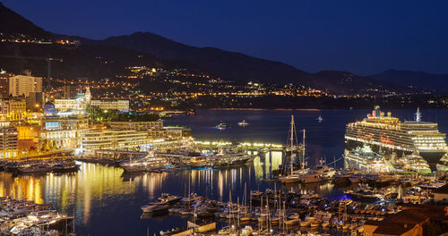 High angle view of illuminated buildings in city at night