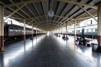 People waiting at railroad station platform