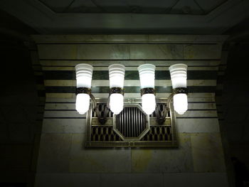 Low angle view of illuminated lighting equipment