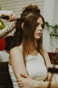 Portrait of a young girl at the hairdresser.
