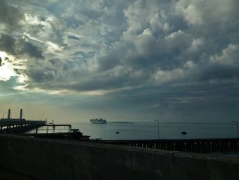 Scenic view of sea against cloudy sky