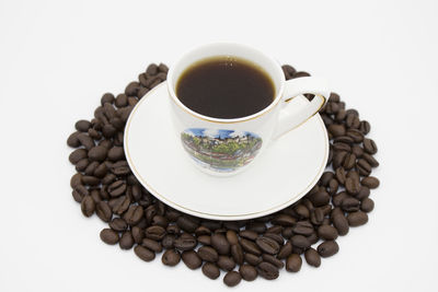 Close-up of coffee cup against white background