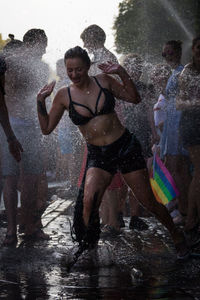 Reflection of woman in water splashing