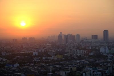 High angle view of buildings against sky during sunset