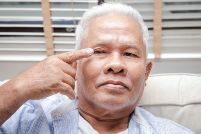 Close-up portrait of man wearing mask