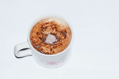 Close-up of coffee cup against white background