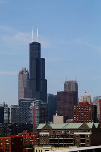 Modern buildings in city against sky