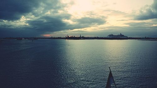 Scenic view of sea against cloudy sky