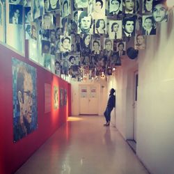 Man walking in corridor of building