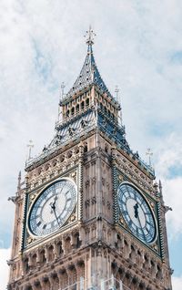 Low angle view of clock tower against sky