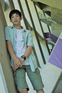 Portrait of boy against architecture column of building