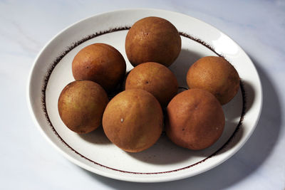 High angle view of fruits in plate on table