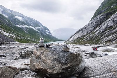 Scenic view of mountains against cloudy sky