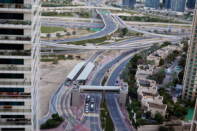 View of a road junction with moving cars on the background of a modern city, travel