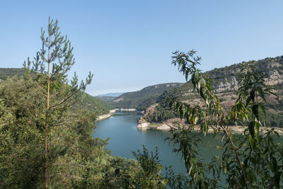 Scenic view of mountains against clear blue sky