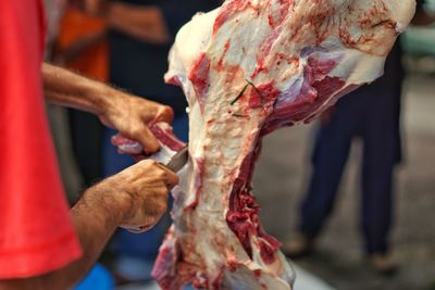 Workers are cutting beef