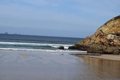 Scenic view of beach against sky