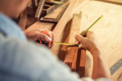 High angle view of man working on table