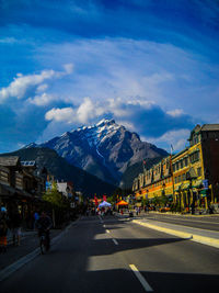 Road leading towards snowcapped mountain at banff