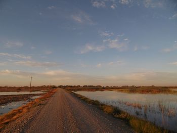 Surface level of road along countryside lake