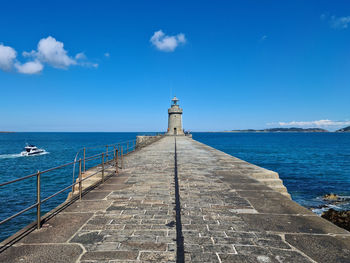 Scenic view of sea against blue sky