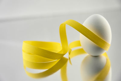 Close-up of lemon slice over white background