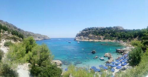 High angle view of sea against clear blue sky