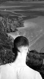 Shadow of man on road