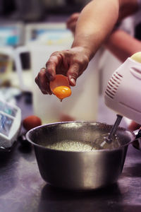 Close-up of man holding ice cream in bowl