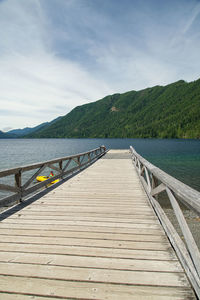 Pier over lake against sky