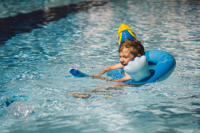 Young man swimming in sea