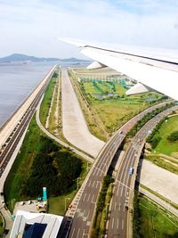 Aerial view of airport runway against sky