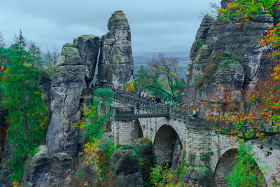 Old ruins against sky, saxon switzerland mountains with beautiful green trees