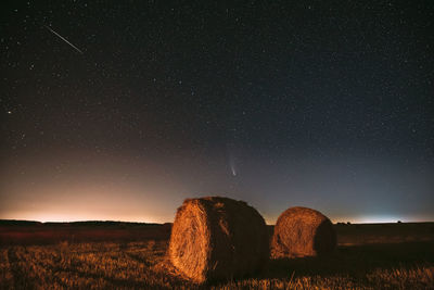 Scenic view of landscape against sky at night