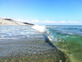 View of beach against blue sky