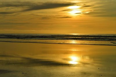 Scenic view of sea at sunset