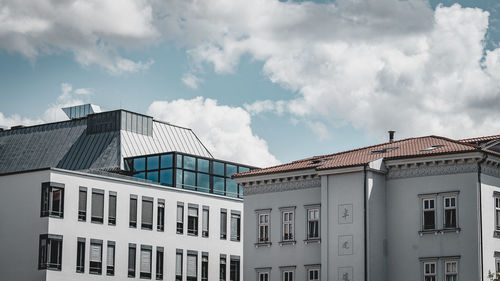 Low angle view of building against cloudy sky