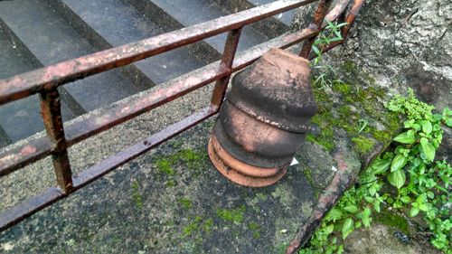 High angle view of old rusty metal railing