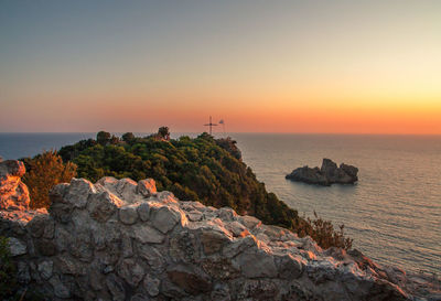 Scenic view of sea against sky at sunset