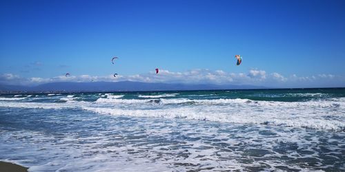 Scenic view of sea against blue sky