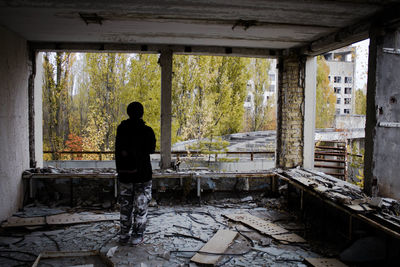 Full length of man standing in abandoned building