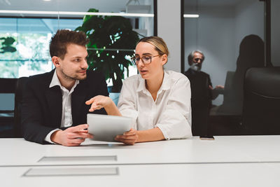 Business colleagues working in office