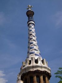 Low angle view of bell tower against blue sky