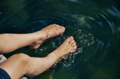 Low section of person in lake