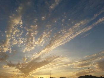 Low angle view of power lines against sky